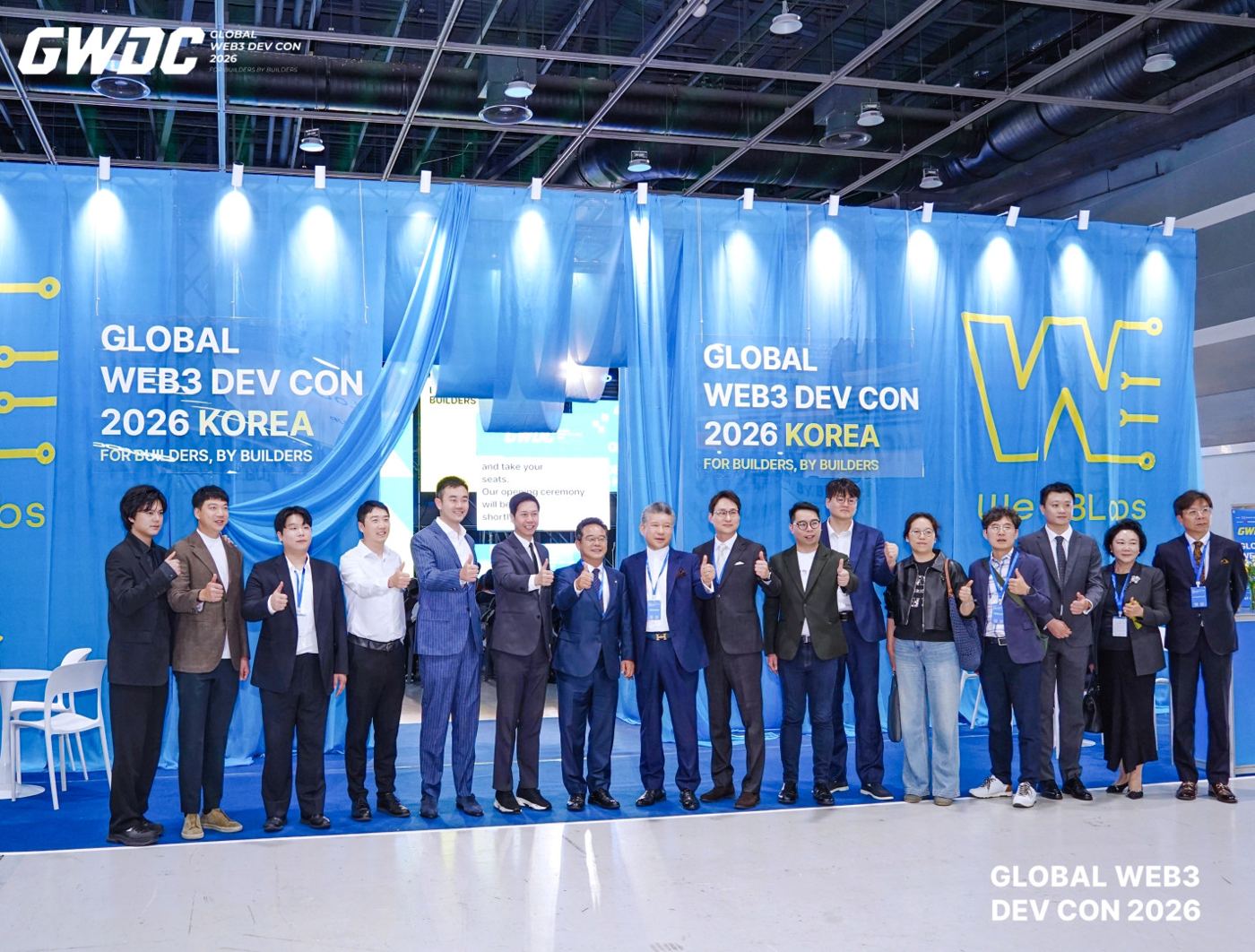 Speakers and guests posing for a group photo inside the GWDC 2026 KOREA venue